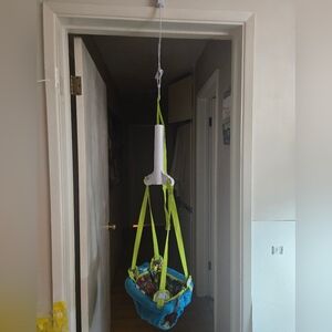 Evenflo ExerSaucer Blue and Green Baby Doorway Jumper. Baby Jumper.